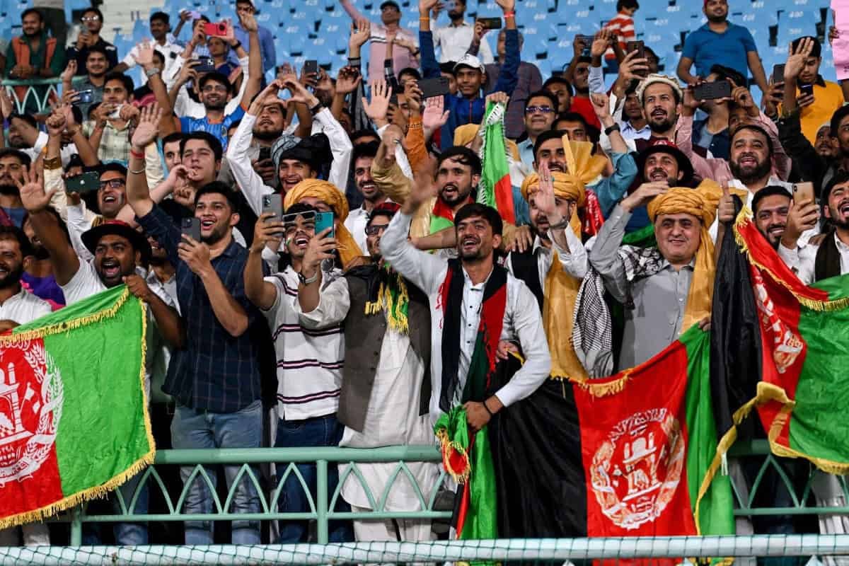 Afghanistan cricket supporters cheering in the stands