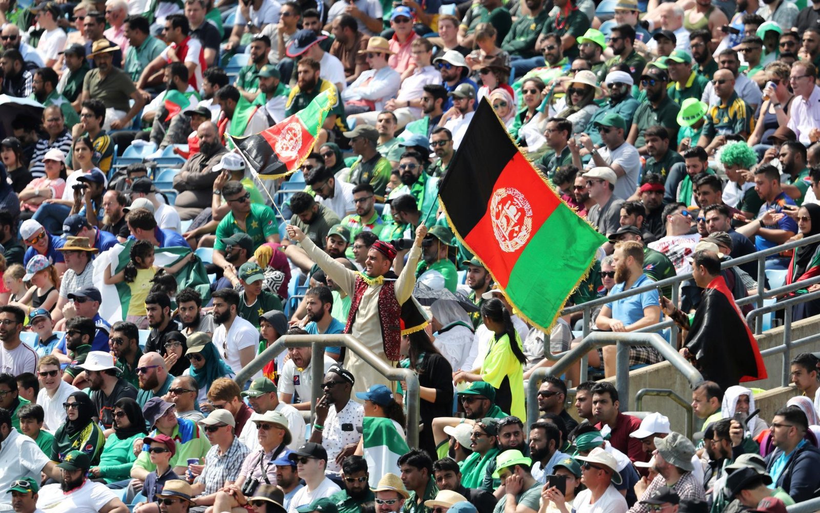 Afghanistan cricket crowd waving flags in the stands